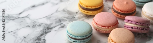 Elevated shot of assorted French macarons in pastel colors, arranged in a neat circle on a marble countertop, soft natural light, minimalist style photo