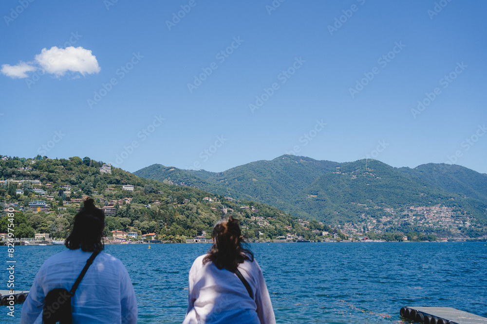 Rear view of women looking at sea from observation point Rear view of women looking at sea from observation point