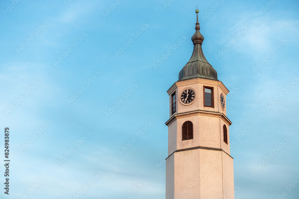 iconic Sahat Kula clock tower stands tall against the blue sky in Kalemegdan, Belgrade.