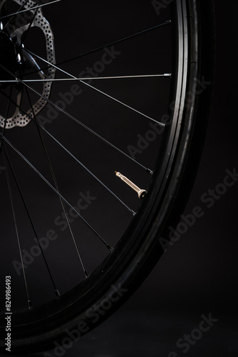 close up of bicycle wheel on dark background