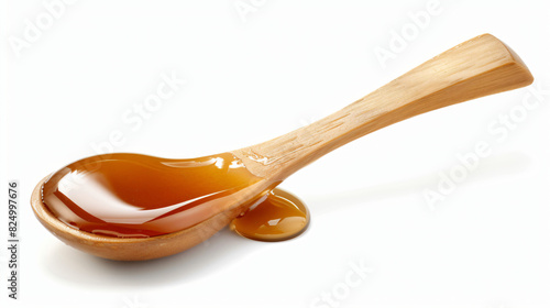 Wooden spoon with delicious caramel syrup isolated on