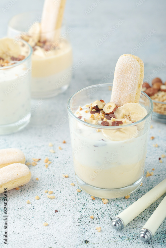 Milk mousse dessert with nuts in glasses Milk mousse dessert with nuts in glasses