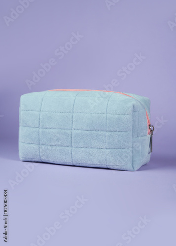 pencil case for makeup on a purple background photo