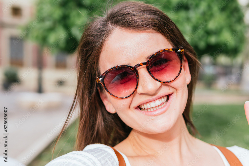 Self-portrait of a smiling traveler visiting a European city Self-portrait of a smiling traveler visiting a European city
