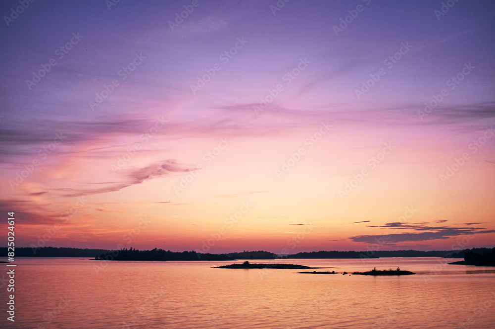 Silhouette islands in sea against sky during sunset Silhouette islands in sea against sky during sunset