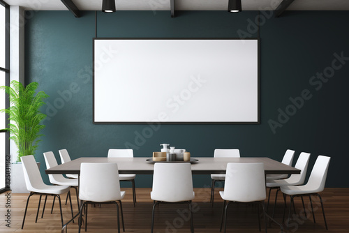 A high-definition shot of a minimalistic meeting room, its wall showcasing a pristine blank frame allowing versatile customization. © NUSRAT ART