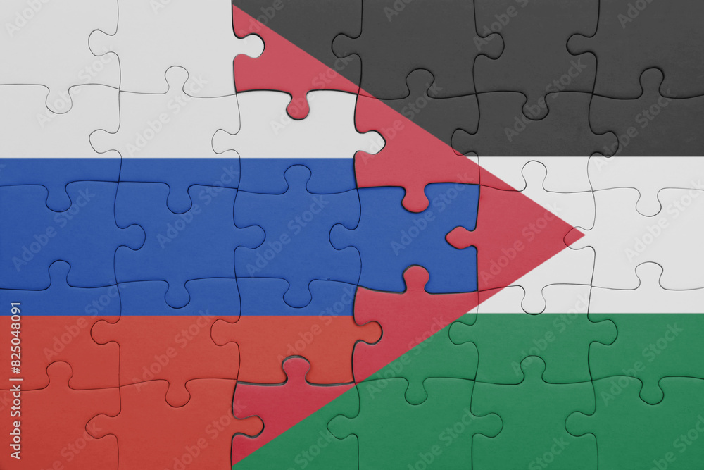 puzzle with the colourful national flag of jordan and flag of russia. puzzle with the colourful national flag of jordan and flag of russia.