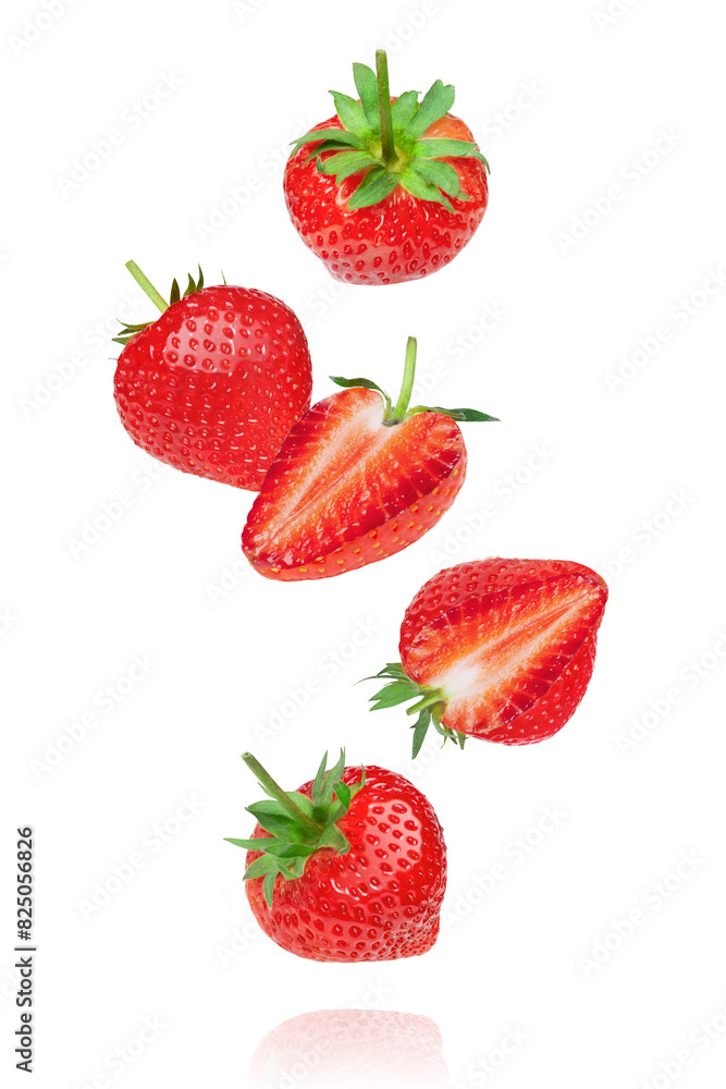 Whole and half strawberry with leaf and half slice flying in the air isolated on white background. Whole and half strawberry with leaf and half slice flying in the air isolated on white background.