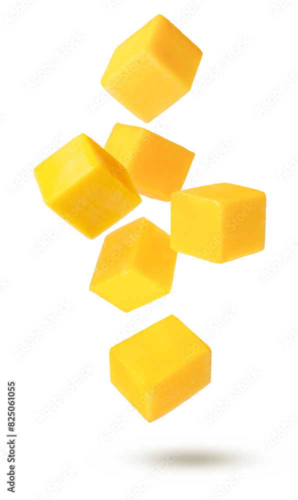 Yellow ripe mango slices flying in the air isolated on white background. Yellow ripe mango slices flying in the air isolated on white background.