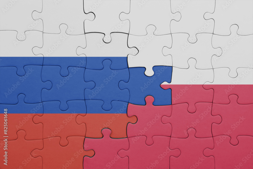 puzzle with the colourful national flag of poland and flag of russia. puzzle with the colourful national flag of poland and flag of russia.