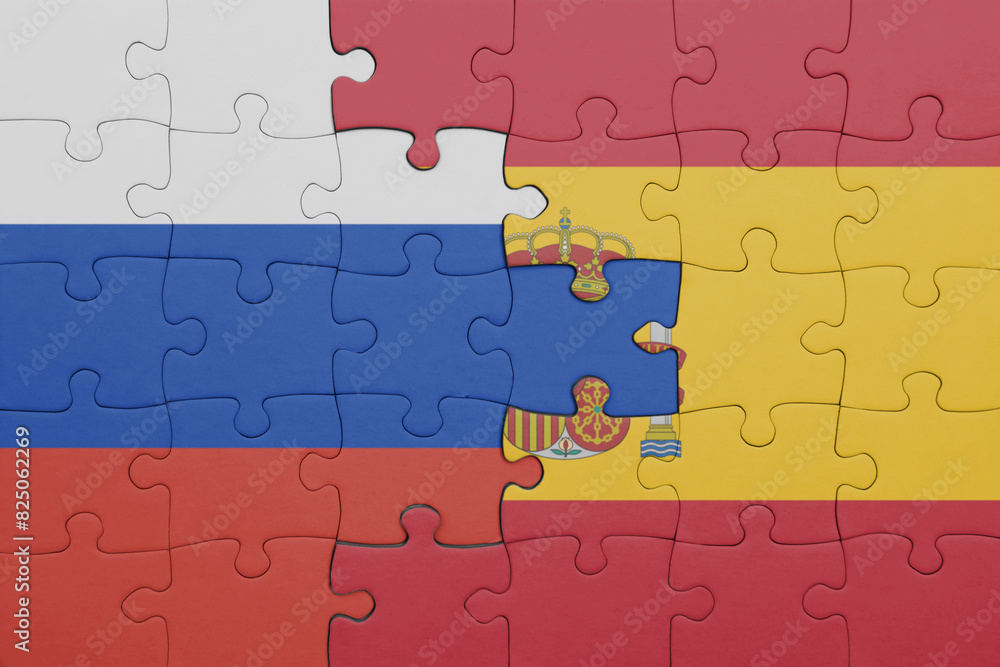 puzzle with the colourful national flag of spain and flag of russia. puzzle with the colourful national flag of spain and flag of russia.
