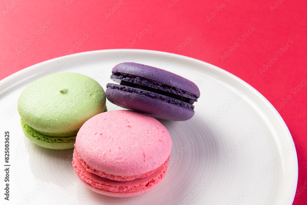 Various macarons in a plate.