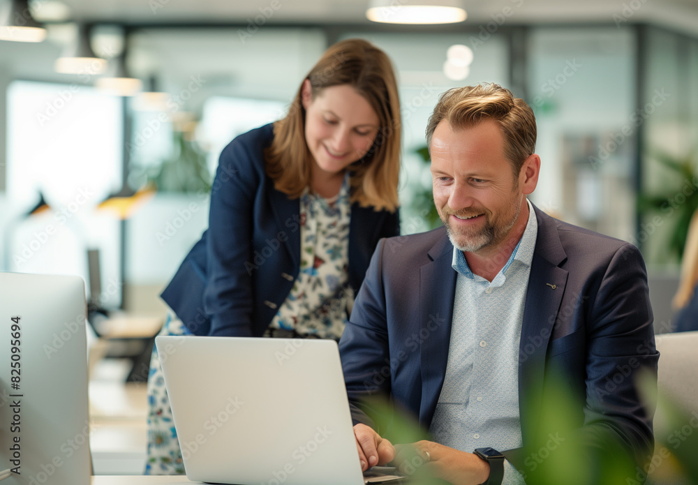 businessman and businesswoman working in office businessman and businesswoman working in office
