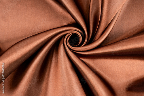 Brown background luxury cloth or wavy folds of grunge silk texture satin photo