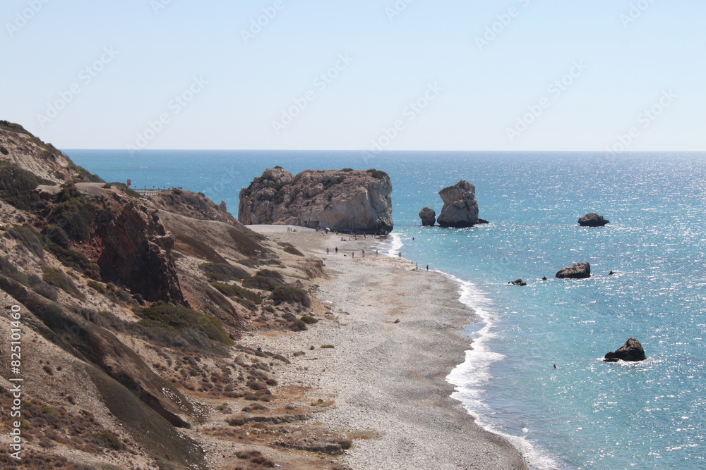 View of the shore at Petra tou Romiou and Aphrodite´s Rock in Paphos, Cyprus at Mediterranean Sea. Popular tourist location. According to mythology it is the birthplace of Aphrodite. Sunny day. View of the shore at Petra tou Romiou and Aphrodite´s Rock in Paphos, Cyprus at Mediterranean Sea. Popular tourist location. According to mythology it is the birthplace of Aphrodite. Sunny day.