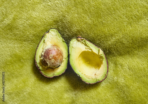 Sliced cut in hald avocado inside close up photo