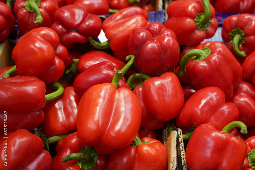 Red bell peppers in the box in grocery store Red bell peppers in the box in grocery store