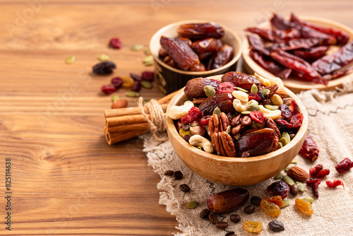 Natural raw foods ingredients and nuts arranged on a wooden table in a flat layout copy space image place for adding text or design. World Pulses Day. African Raw Foods