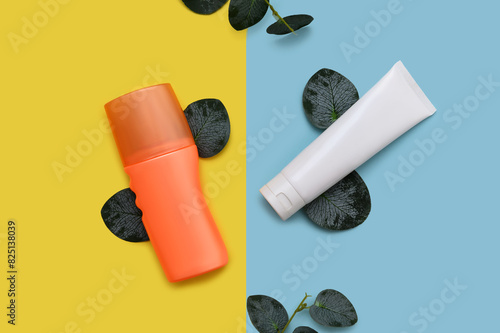 Cleansing lotion and cosmetic cream on paper background.