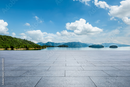 Empty square floor and lake with island nature background © ABCDstock