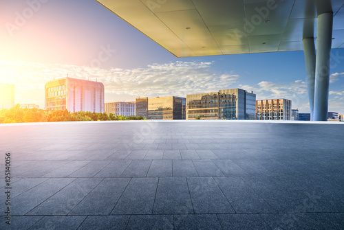 Empty square floor with modern city buildings background