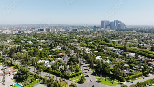 Beverly Hills Aerial 2024 - Dollying right and rising to reveal greater city and neighborhood