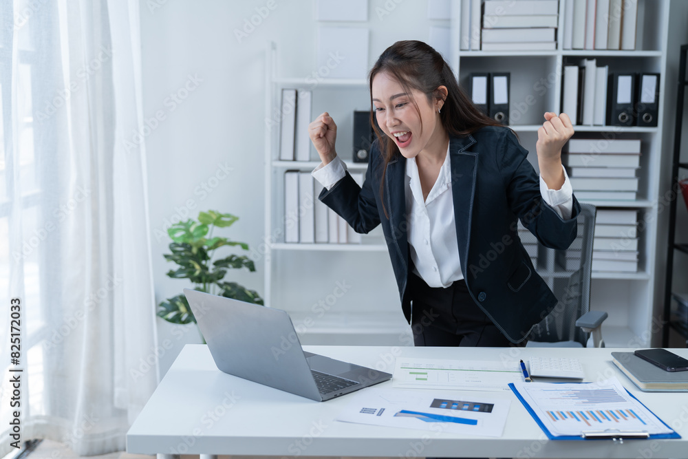 Happy businesswomen working at the office 
