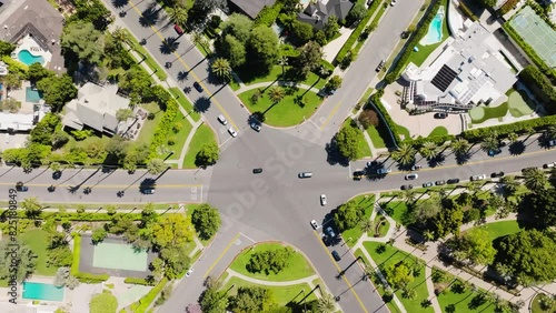 Beverly Hills Aerial 2024 - Top down rising and lowering to reveal streets and famous intersection 