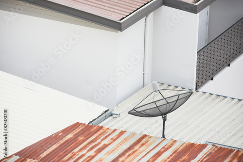 Rusted tin roof and satellite dish on the roof