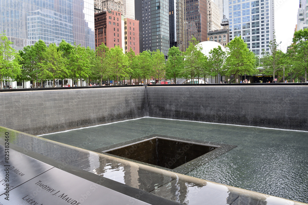 New York, USA - May 13 2023: Serene water pools at the 9/11 Memorial in ...