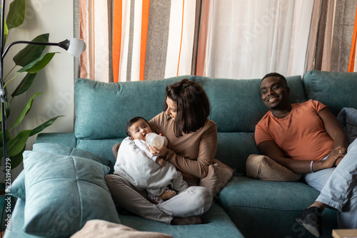 multiracial couple with baby at home photo