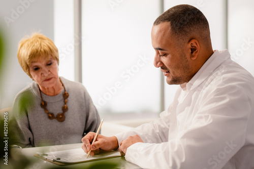 An elderly woman at a doctor's appointment photo