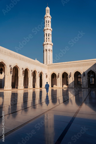 Man Walking in Grand Mosque in Omán photo