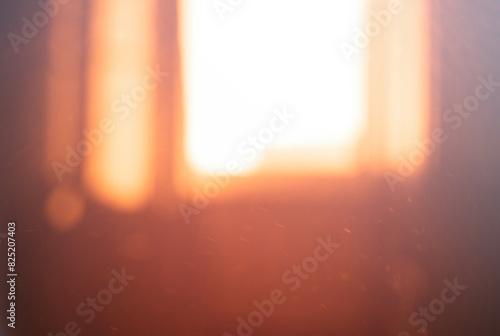 Dramatic dust in the room illuminated by sunset light