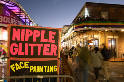 Nipple Glitter and Face Painting on Bourbon St during Mardi Gras photo