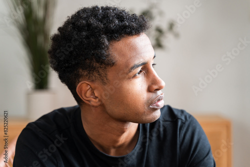 Casual Man Seated with Pensive Look