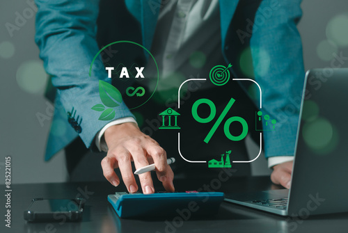 Environmental tax breaks concept. Businessman touching green taxes icons.Using environmental taxes, carbon tax, environmentally beneficial tax incentives in order to achieve environmental targets.