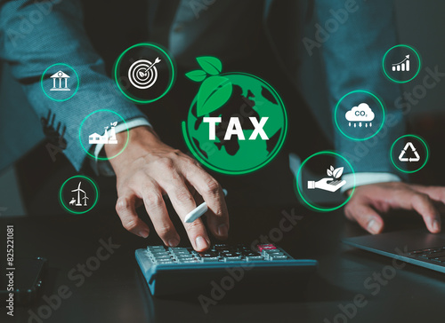 Environmental tax breaks concept. Businessman touching green taxes icons.Using environmental taxes, carbon tax, environmentally beneficial tax incentives in order to achieve environmental targets.