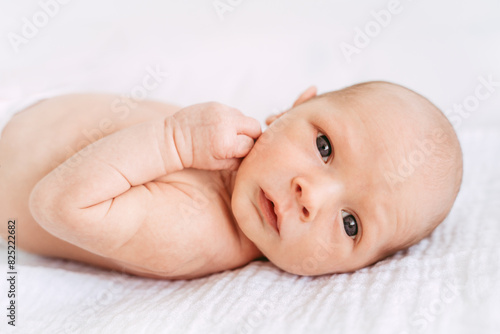 Cute awake baby looking at the camera.