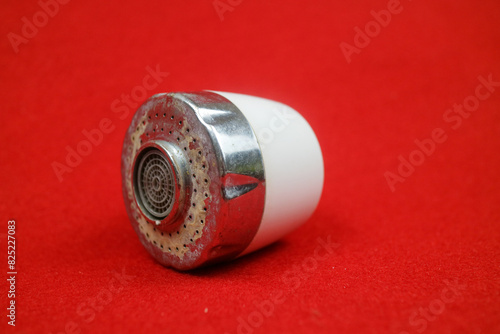 The head of the sink drain. used condition. red background