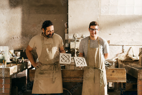 Photography Two Skilled Artisans Proudly Display Barcelona Panot Tiles in Workshop