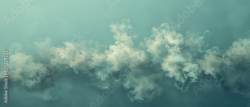 A serene image of soft, fluffy clouds floating against a calm blue sky, creating a tranquil and peaceful atmosphere.