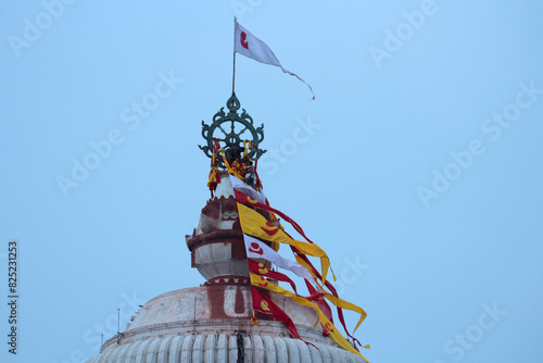 Sudarshana Chakra is an attribute of Vishnu on the dome of the Jagannath Temple in Puri at dusk.