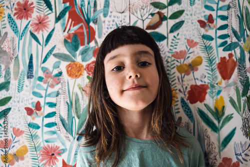 Joyful Child portrait with a Floral Backdrop photo