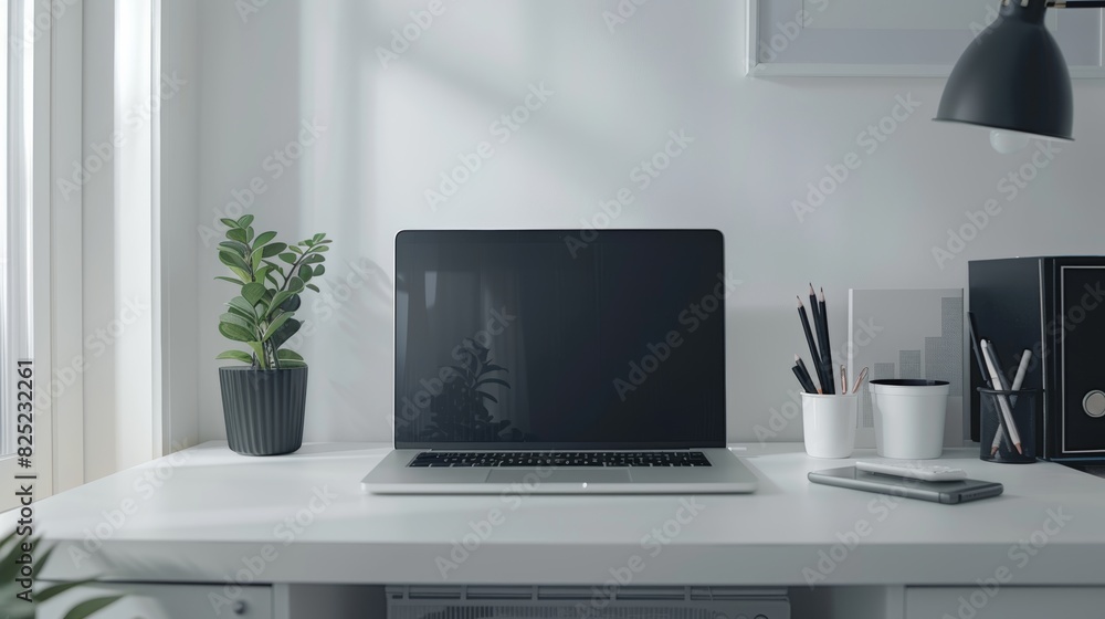 A minimalist office workspace with a clean white desk, a modern laptop, and a few stationery items. A minimalist office workspace with a clean white desk, a modern laptop, and a few stationery items.