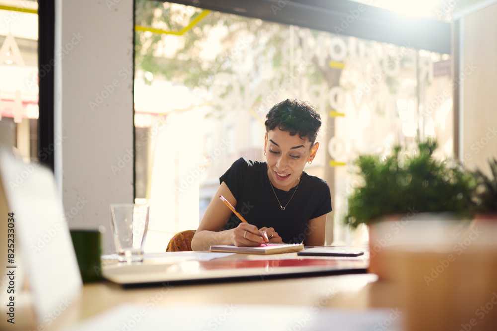 Businesswoman writing at business office Businesswoman writing at business office