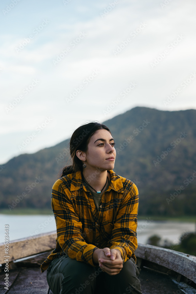 Relaxed woman observing beautiful landscape in the mountain Relaxed woman observing beautiful landscape in the mountain