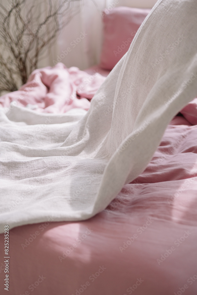 Close-up of pink bed linen texture and folds Close-up of pink bed linen texture and folds