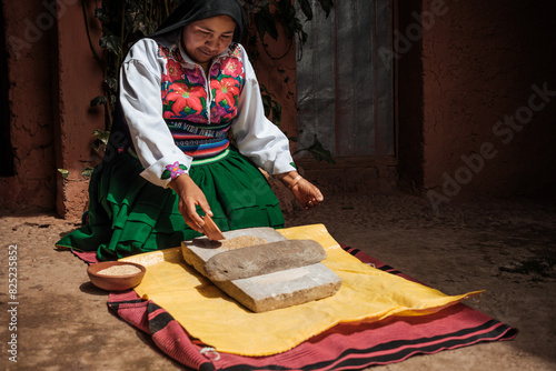 woman using a rural traditional kitchen technique photo