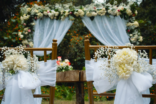 Wedding Chairs and Floral Arch